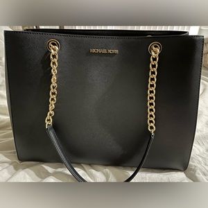 Michael Kors tote. Only used twice. Black with gold chains.
